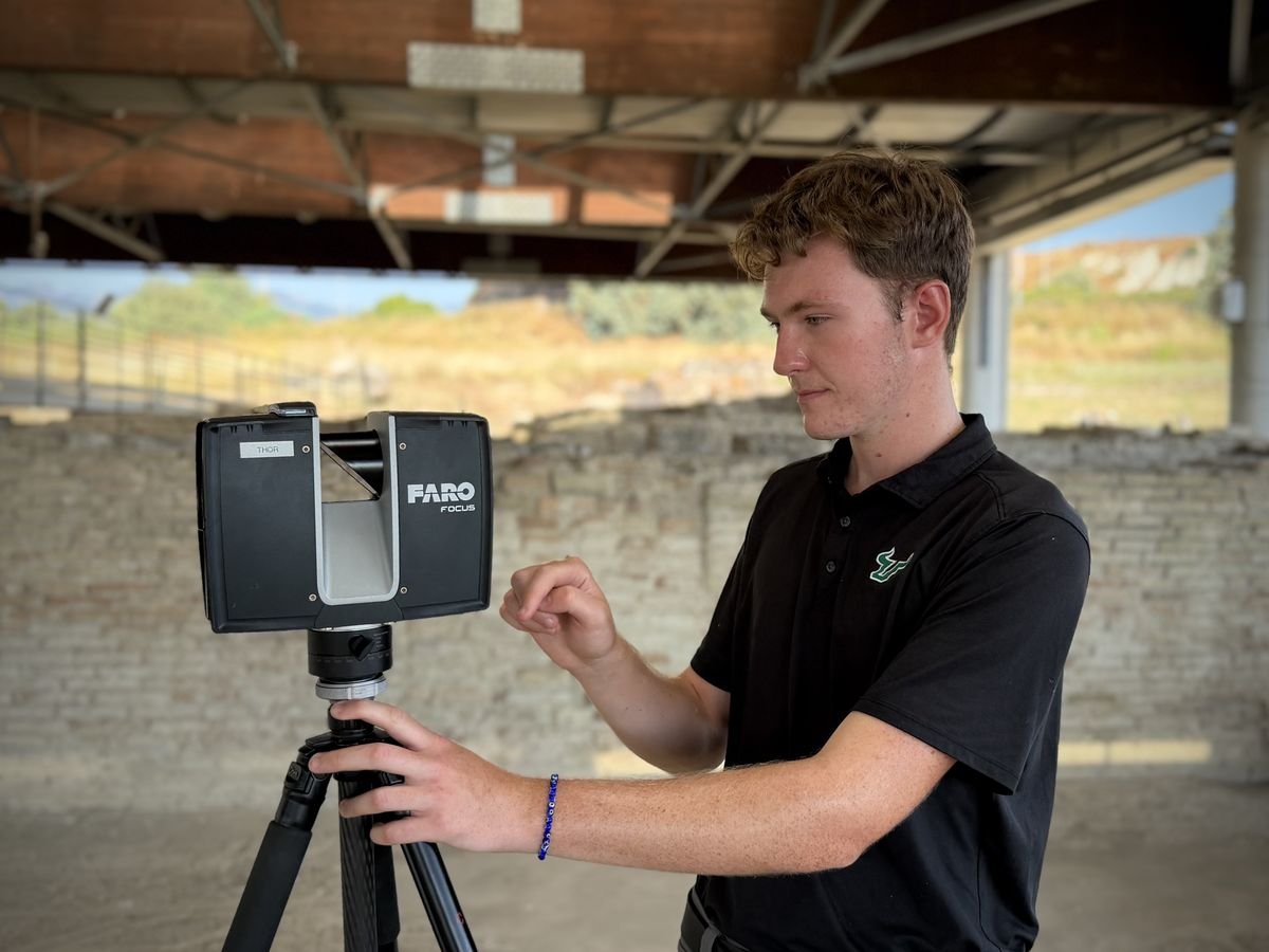 Setting up a FARO laser scanner beneath a site shelter
