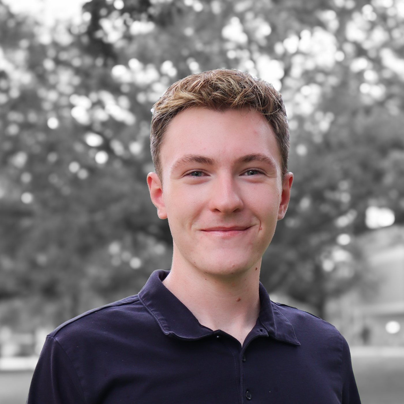 Portrait of Aiden Eylward outdoors under oak trees